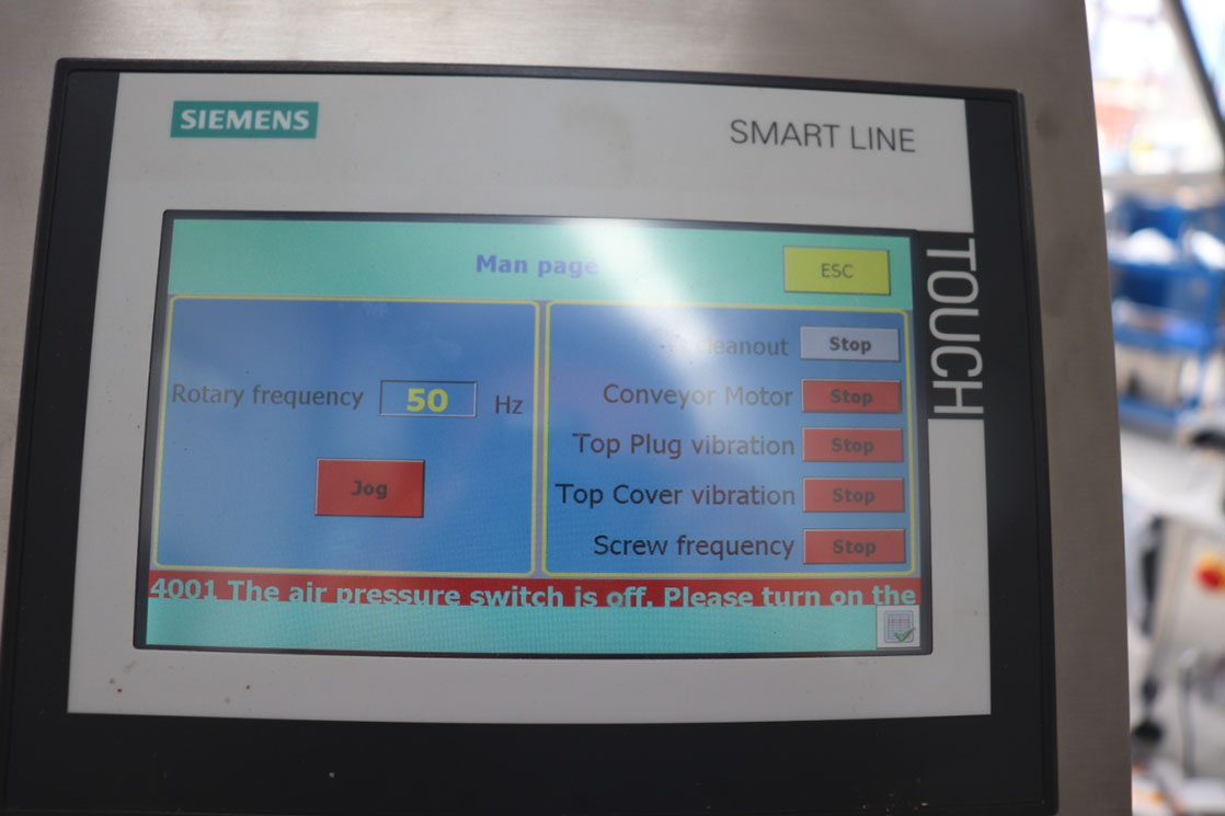 Small bottle filling, plugging and capping machine13